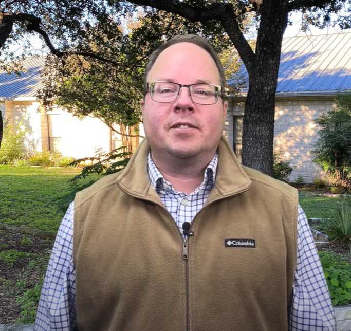 Portrait of Jason Homan, the Chief Executive Officer of Travis County WCID No. 17 posing in an outdoor setting.